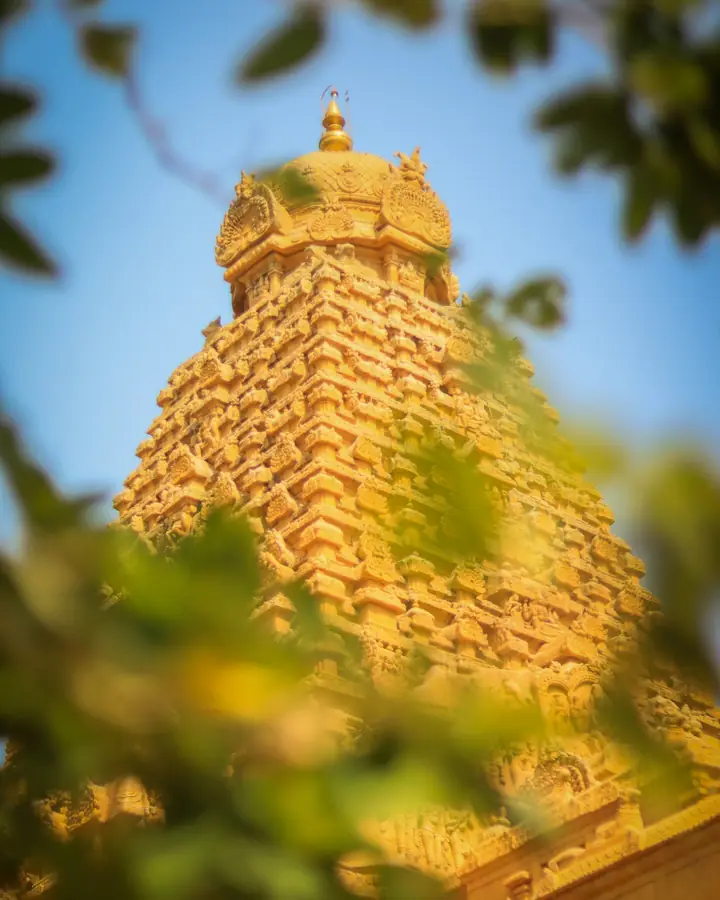 A carved temple tower in golden light